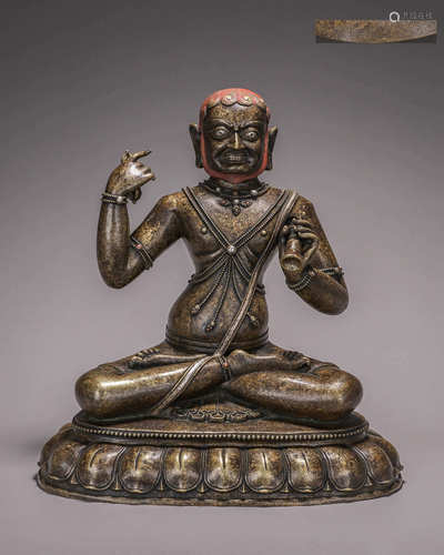 A silver-inlaid copper buddha statue