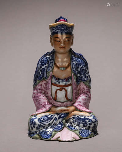 A famille rose buddha statue