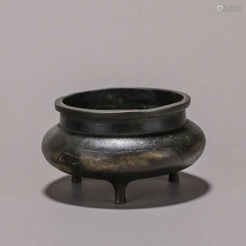 A three-legged copper censer