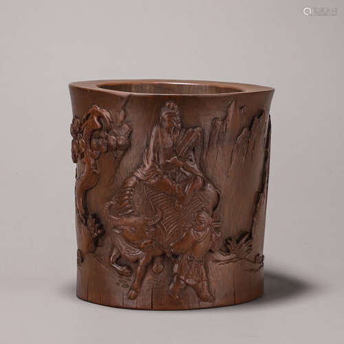 A carved bamboo brush pot