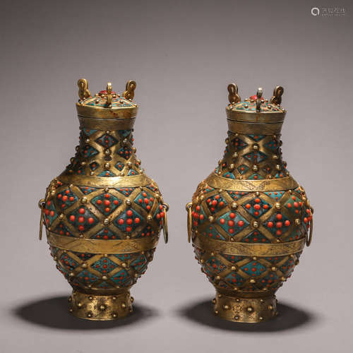 A pair of gilding copper gem-inlaid vases