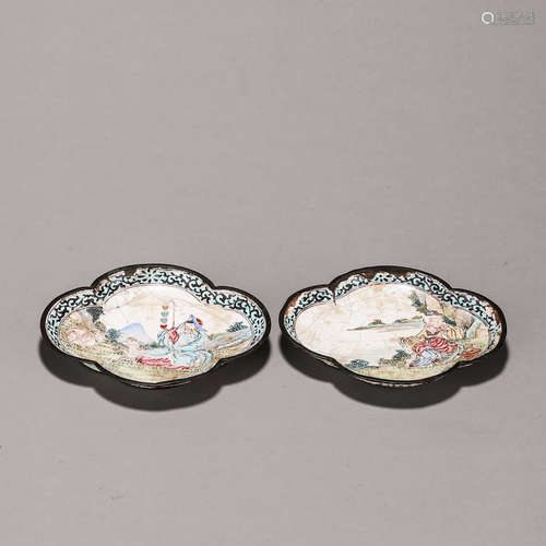 A pair of copper enamel tea saucers