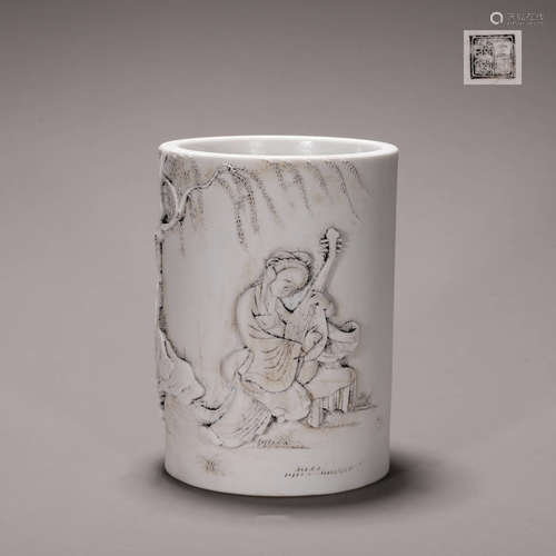 A figure carved porcelain brush pot