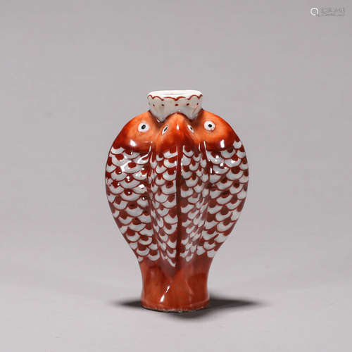 An iron red fish porcelain snuff bottle