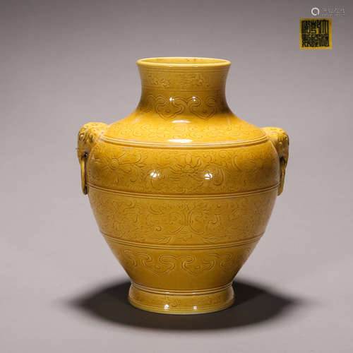 A yellow glazed flower carved porcelain zun