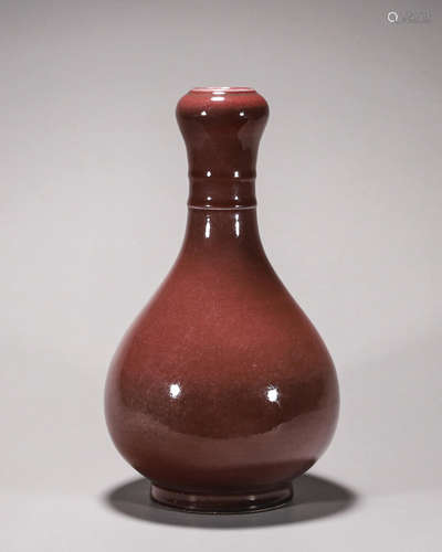 A deep red glazed porcelain vase