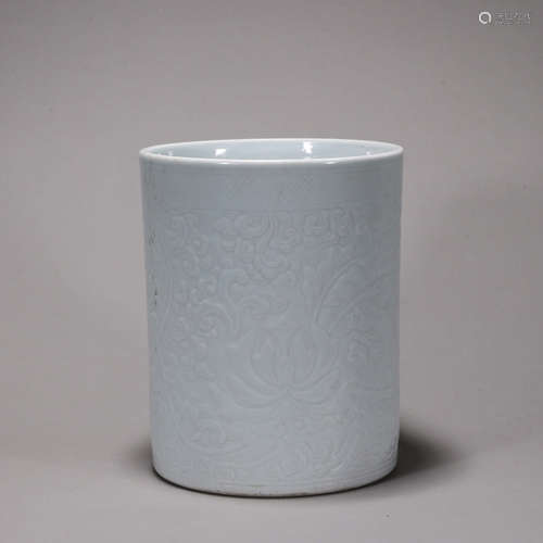 A white glazed flower carved porcelain brush pot