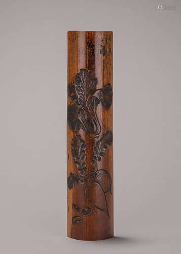 A melon carved bamboo arm rest