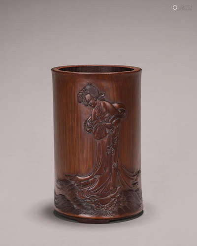 A figure carved bamboo brush pot