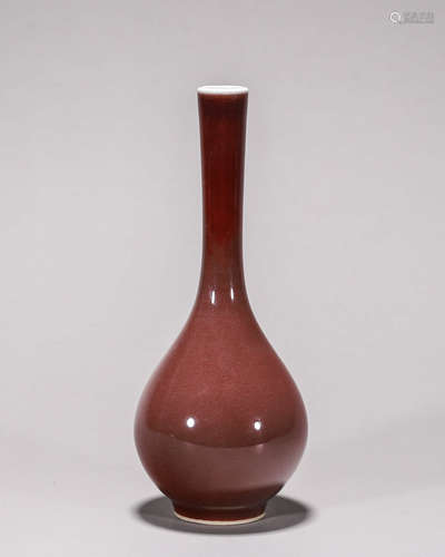 A deep red glazed porcelain vase