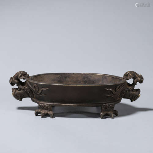 A copper censer with dragon shaped ears