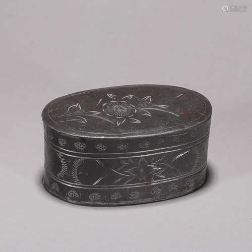 A flower patterned silver box