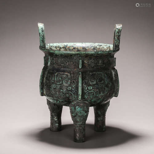 A taotie patterned bronze three-legged pot