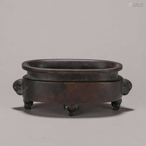 A copper censer with elephant head shaped ears