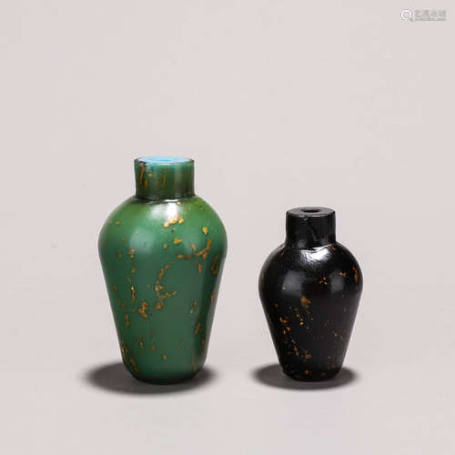 A pair of gold sprinkled glass snuff bottles