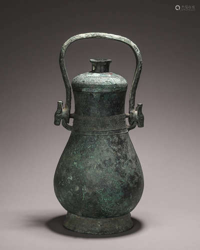 A bronze loop-handled pot