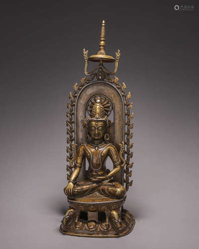 A silver-inlaid copper buddha statue