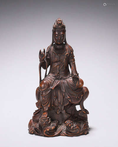 A fragrant rosewood Guanyin statuette