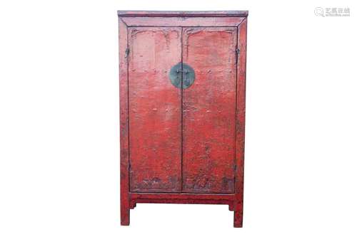 A Chinese red lacquer cabinet