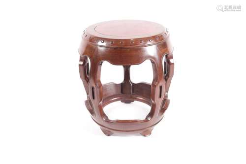 A Chinese hongmu drum form vase stand