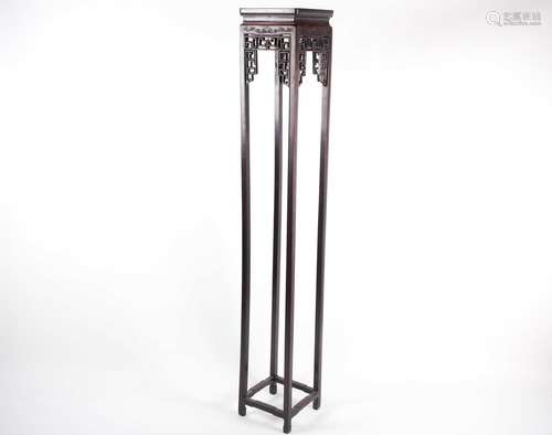 A Chinese hongmu tall vase stand