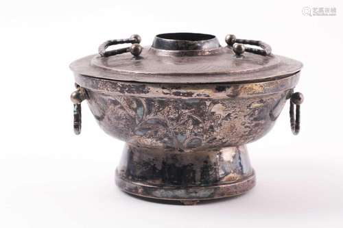 A Chinese silver coloured hot pot