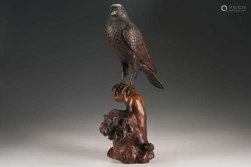 A Japanese bronze okimono of a hawk