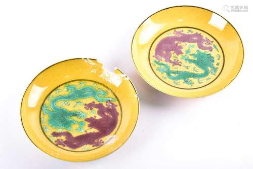 A pair of Chinese porcelain dragon saucer dishes