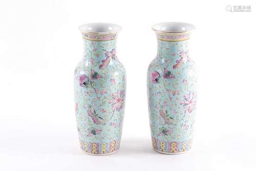 A pair of Chinese famille rose rouleau vases