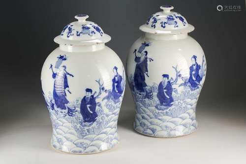 A pair of Chinese blue and white vases and covers