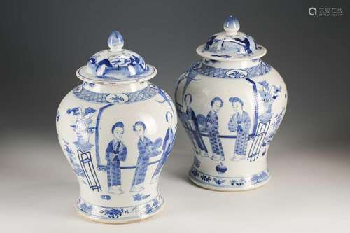 A pair of Chinese blue and white vases and covers