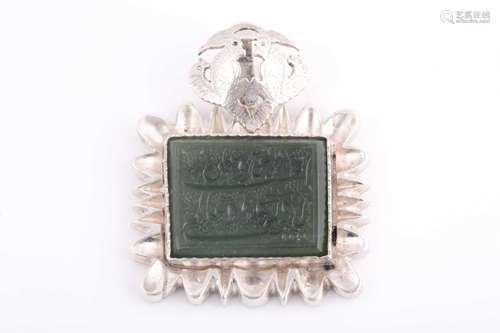 An Indo Persian white metal and jade pendant