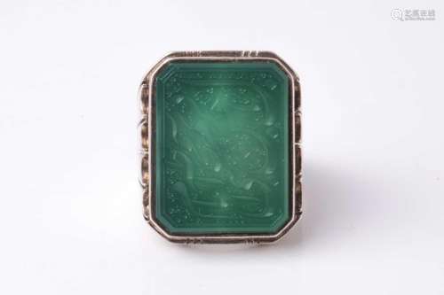 An Eastern white metal gentleman's ring set with a canted re...