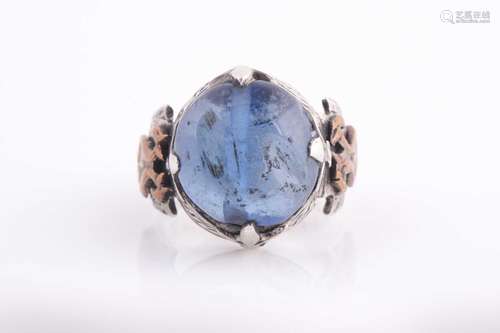 An Indo Persian white metal and blue glass gentleman's ring