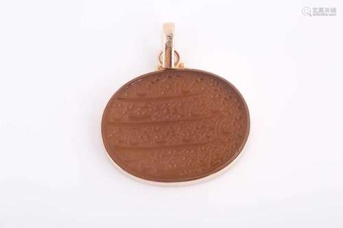 An Indo Persian hardstone pendant in yellow metal mount