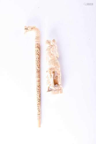 A Chinese carved ivory parasol handle