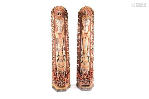 A pair of Balinese carved and painted wood statues