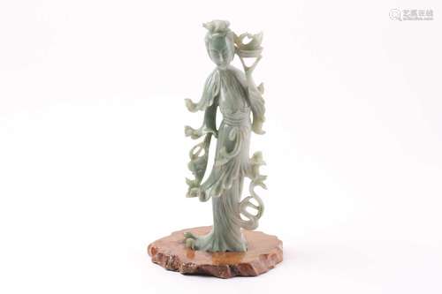 A Chinese carved jadeite figure of Guanyin