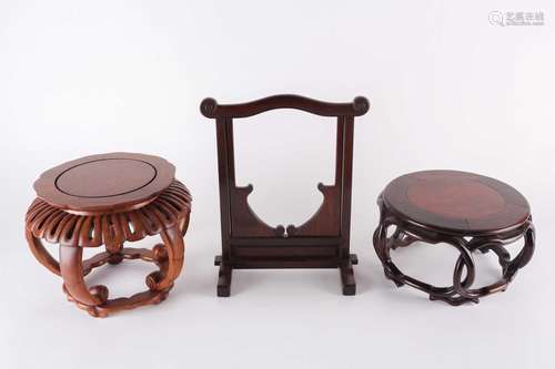 Two Chinese hardwood vase stands and a hardwood hanging jade...