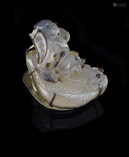 An attractive carved agate carving of a 'boy riding on