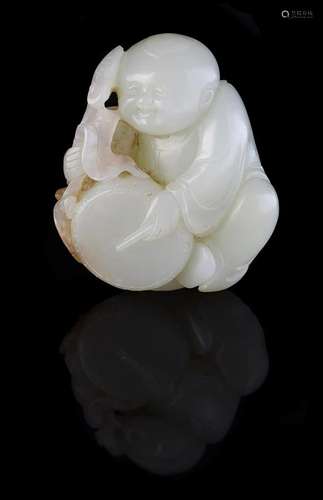 A Chinese 'Boy and Drum' pale celadon jade carving