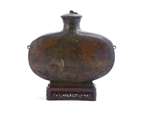 A Chinese bronze ritual wine vessel and cover