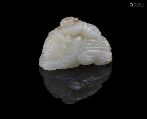 A small Chinese pale celadon jade carving of a man and