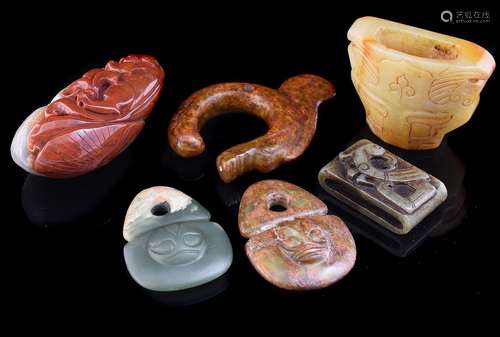 Two Chinese archaic jade style toggles with masks