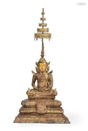 A lacquered and gilt bronze large figure of Buddha