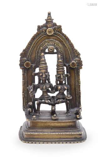 An Indian bronze shrine depicting Siva and Parvati