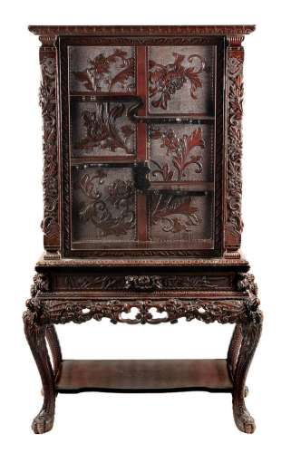 A Chinese carved hardwood cabinet