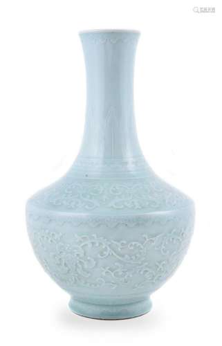 A Chinese carved celadon-glazed bottle vase