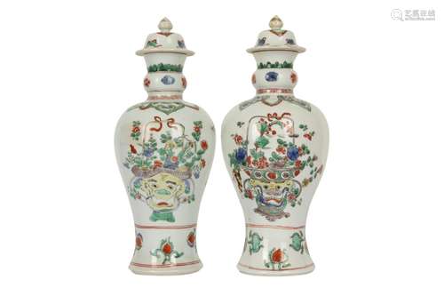 A NEAR-PAIR OF CHINESE FAMILLE VERTE BALUSTER VASES AND COVE...