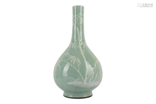 A LARGE CHINESE SLIP-DECORATED CELADON PEAR-SHAPED VASE.